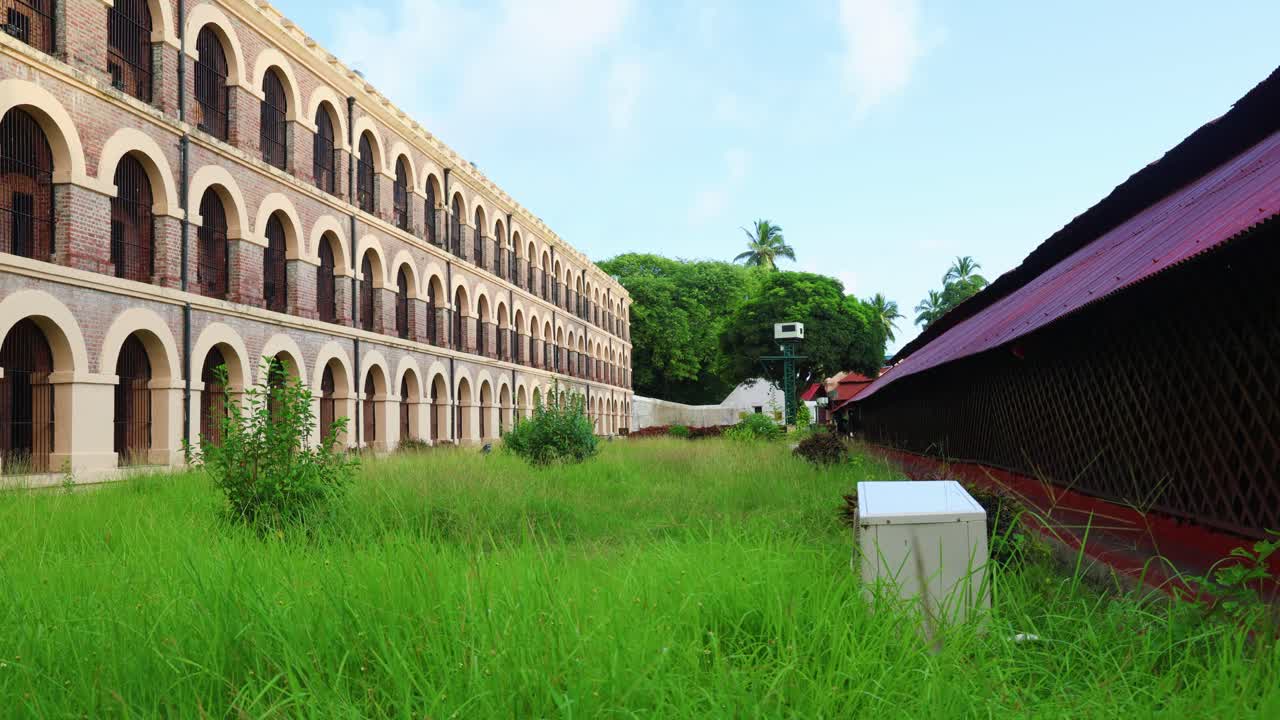 Exterior view of a building with lush green grass