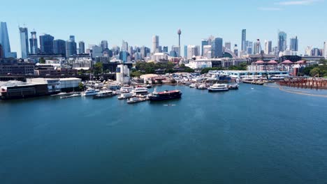 aerial drone pan shot of ferry boats in harbour blackwattle bay sydney fish market industry travel tourism beautiful scenic cityscape sydney cbd nsw australia 4k