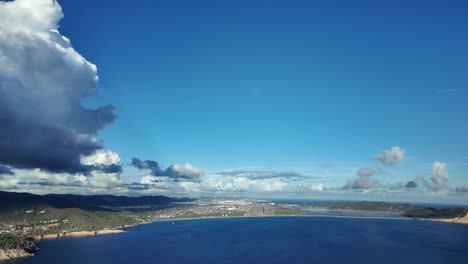 real time approach to ibiza’s airport as seen by the pilot’s of a jet from the cockpit with the runway 06 ahead and some white clouds in a sunny blue sky. immersive pilot’s perspective. 4k