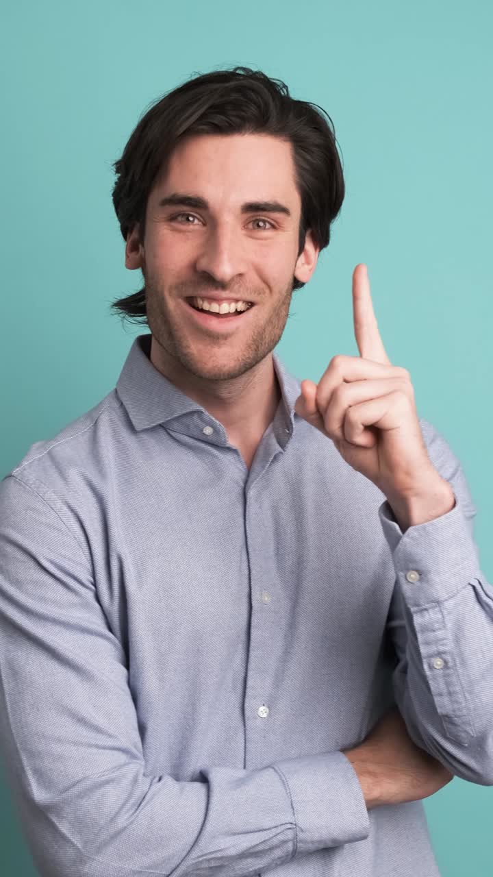 Thoughtful man with great idea in blue studio
