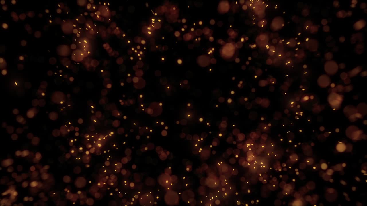 Scintille dorate astratte che esplodono e fluttuano su sfondo nero