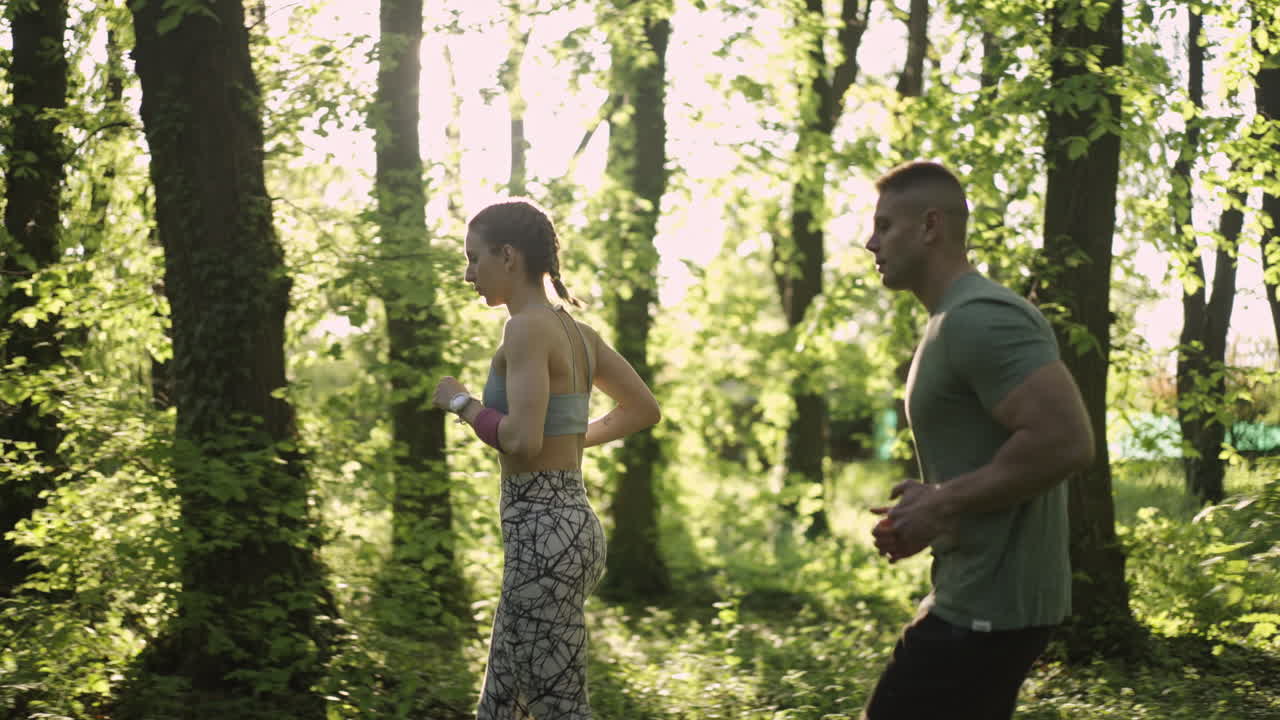 Couple running in a forest
