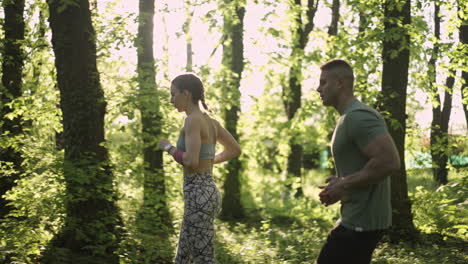 couple running in a forest
