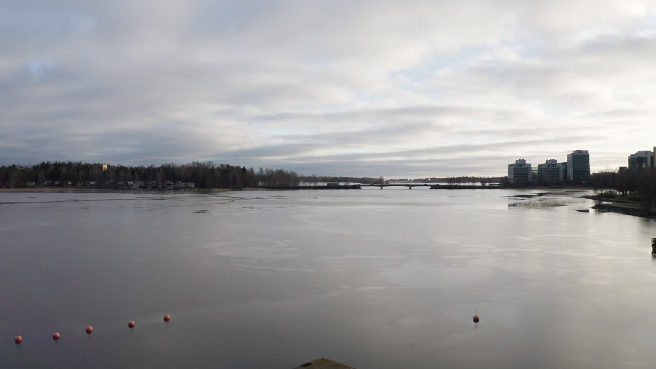 Flying above water surface near boat pier