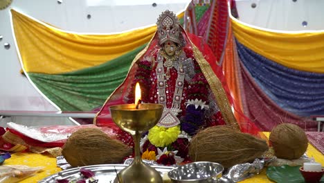 lit brass lamp with hindu goddess durga mata ji at celebration of navratri 2