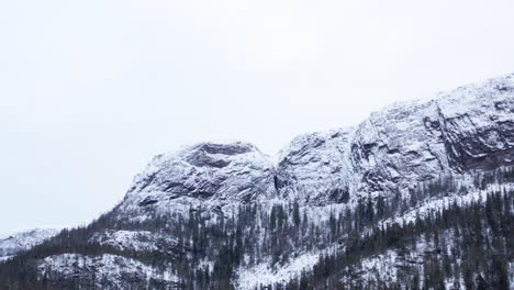 Monochrome-Of-Massif-Rock-Mountains-Covered-With-Fresh-Snow-In-Norway