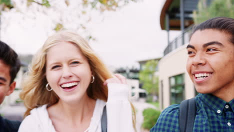 portrait of high school students outside college buildings