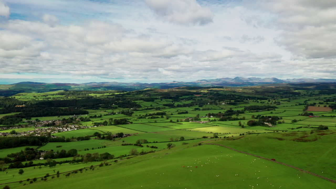 Aerial countryside landscape showing the rural farmland of the English Lake District, bright sunny day
