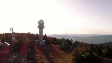 4k drone cinematic aerial view of a weather station high up from above in the tatras mountain range, slovakia