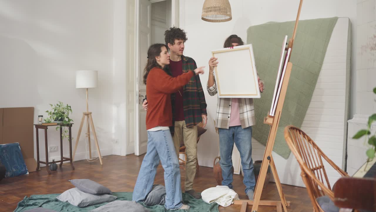 Friends Evaluating Artwork in a Home