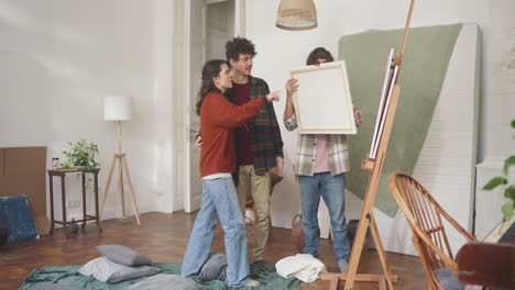 friends evaluating artwork in a home