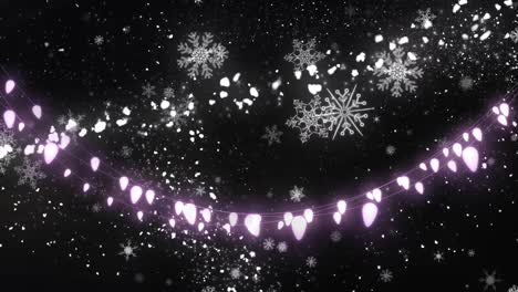 Animation-of-glowing-strings-of-fairy-lights-and-glittering-shooting-star-and-snowflakes