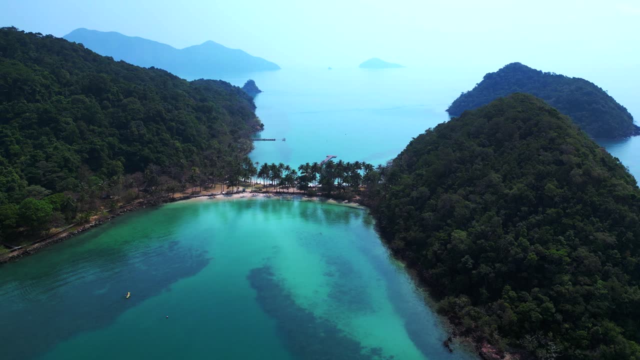 Scenic aerial view of lush green hills and turquoise waters on Koh Chang Ngam Island. Marvelous aerial view flight speed ramp hyper motion time lapse