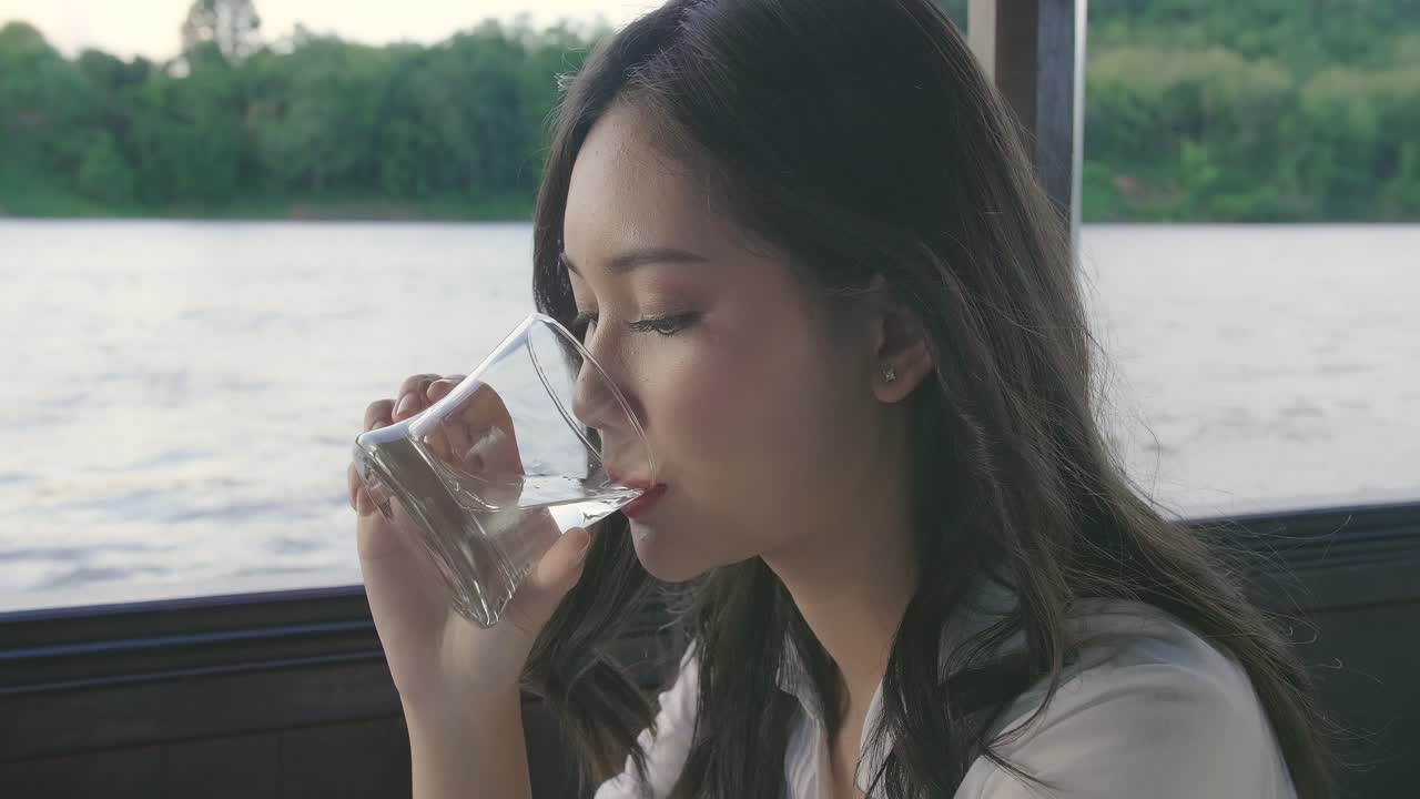 Girl Drinking Water And Looking View, Video In 4K