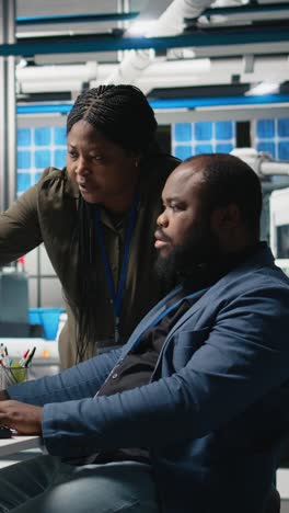vertical video african american master engineers examining photovoltaics activity