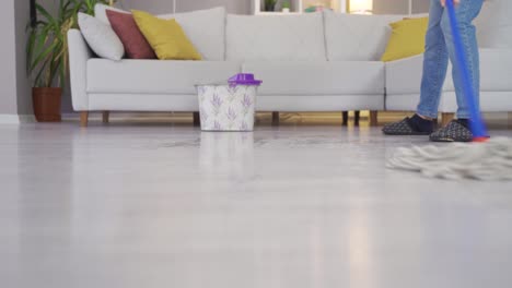 Female-feet-mopping-the-house.