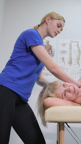 Physical Therapist Massaging a Patient's Shoulder