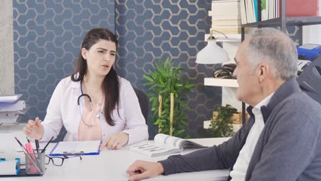 Female-doctor-talking-to-her-elderly-patient-at-the-hospital.