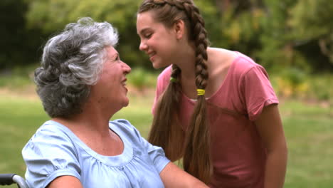 little girl kissing her grandmother