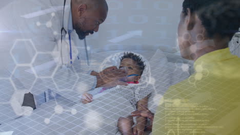 animation of medical data over boy patient with african american male doctor