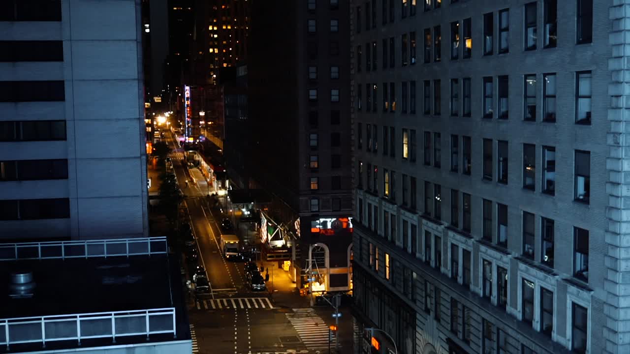 City Lights And Vehicles On Urban Road Surrounded With High Rise Buildings In New York, USA During Night Time - timelapse