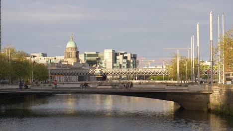 The-Custom-House-Dome,-Tara-Street-Railway-Line-And-Butt-Bridge-Over-Liffey-River-From-Rosie-Hackett-Bridge-In-Dublin,-Ireland