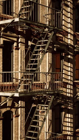 a fire escape on the side of a brick building.