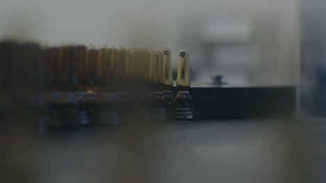 close-up view of a machine that quickly moves and selects bottles, ensuring fast and efficient processing.
