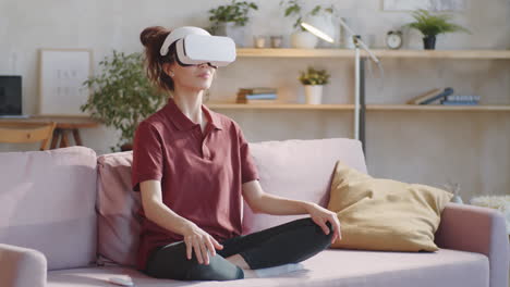 woman in vr headset meditating at home