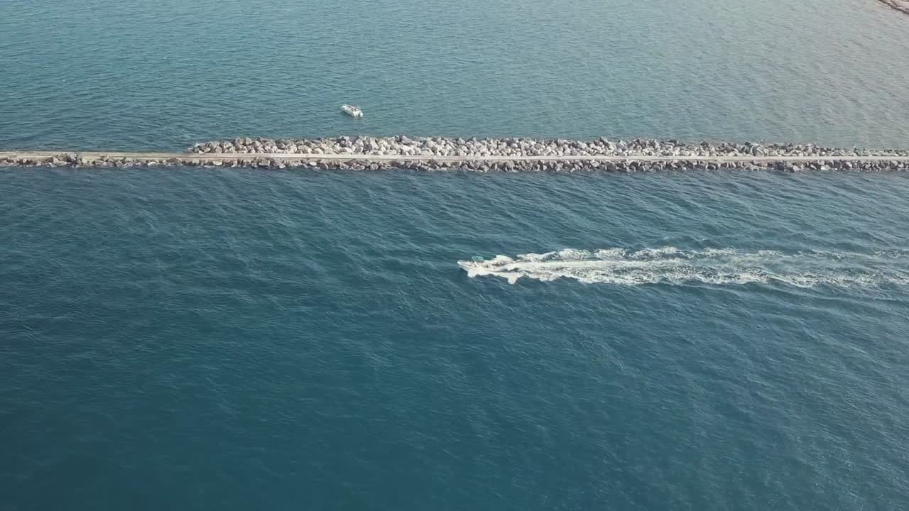 4K Aerial Drone Footage of Fishing Boat leaving Harbor going to the ocean in Palm Beach Florida