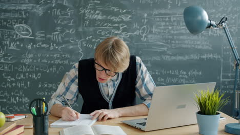 student or teacher working in a classroom