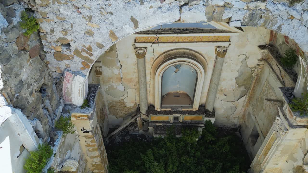 Aerial drone footage of old Poggioreale, Sicily: abandoned ghost town destroyed by the 1968 earthquake, surrounded by hills and silence. Ideal for history, decay, and documentary projects