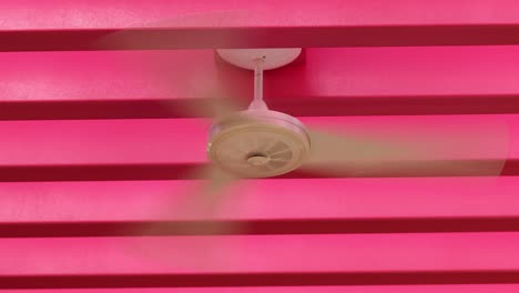 ventilator fan with pink bright background color patterns venting air from ceiling