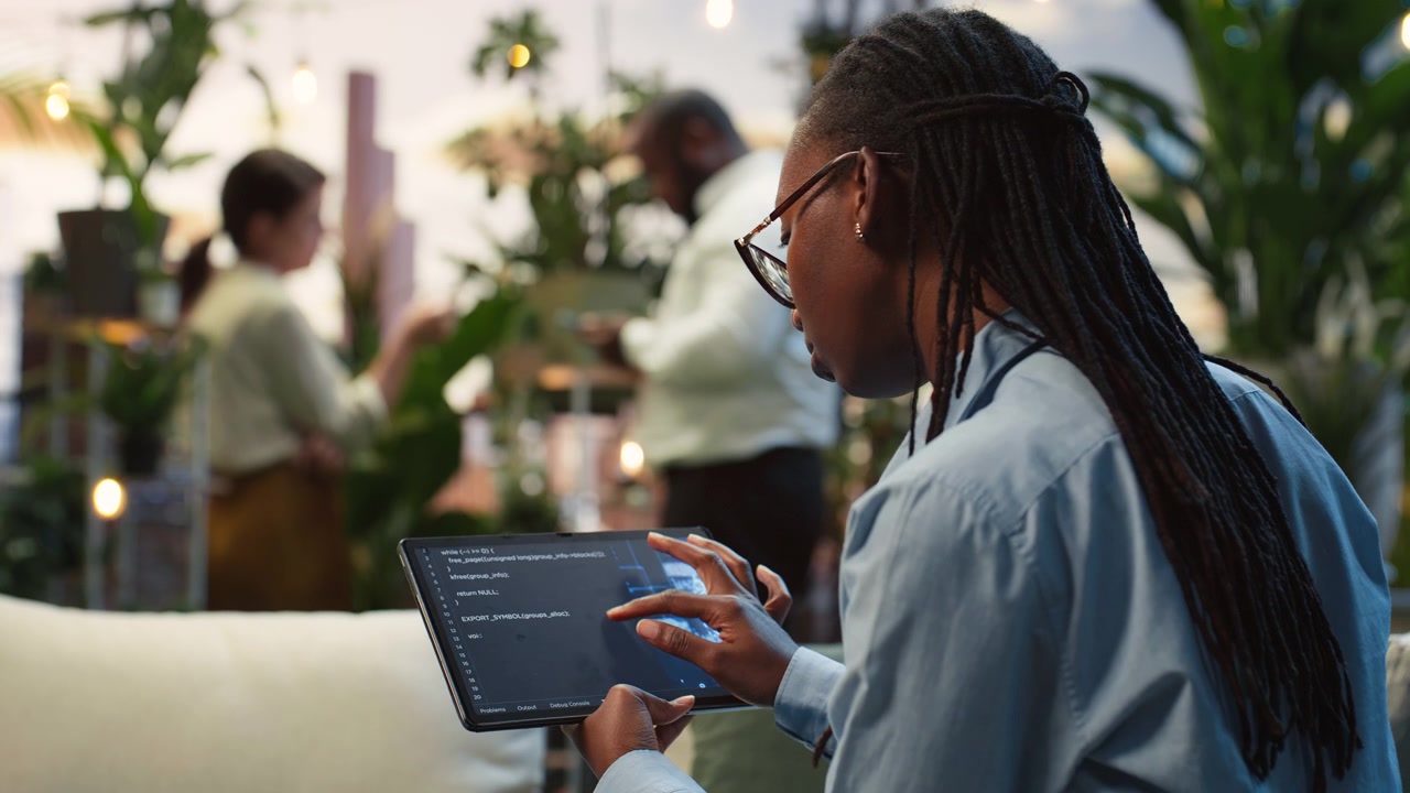 Businesswoman using AI dashboard on tablet touchscreen on rooftop lounge