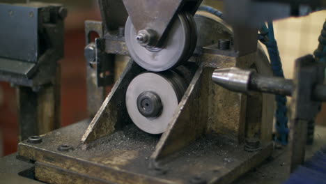 Lathe-machine-processing-metal-shaft-at-metalworking-factory