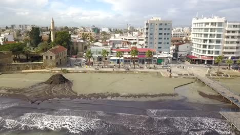 planned slider shot from finikoudes street passing by famous larnaca medieval fort towards mackenzie street, cyprus , europe