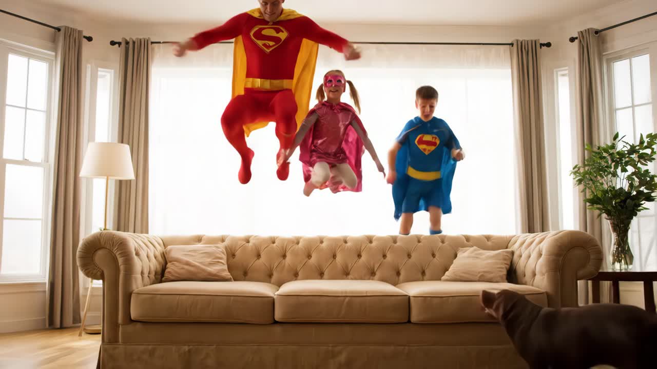 Family dressed as superheroes jumping on a couch