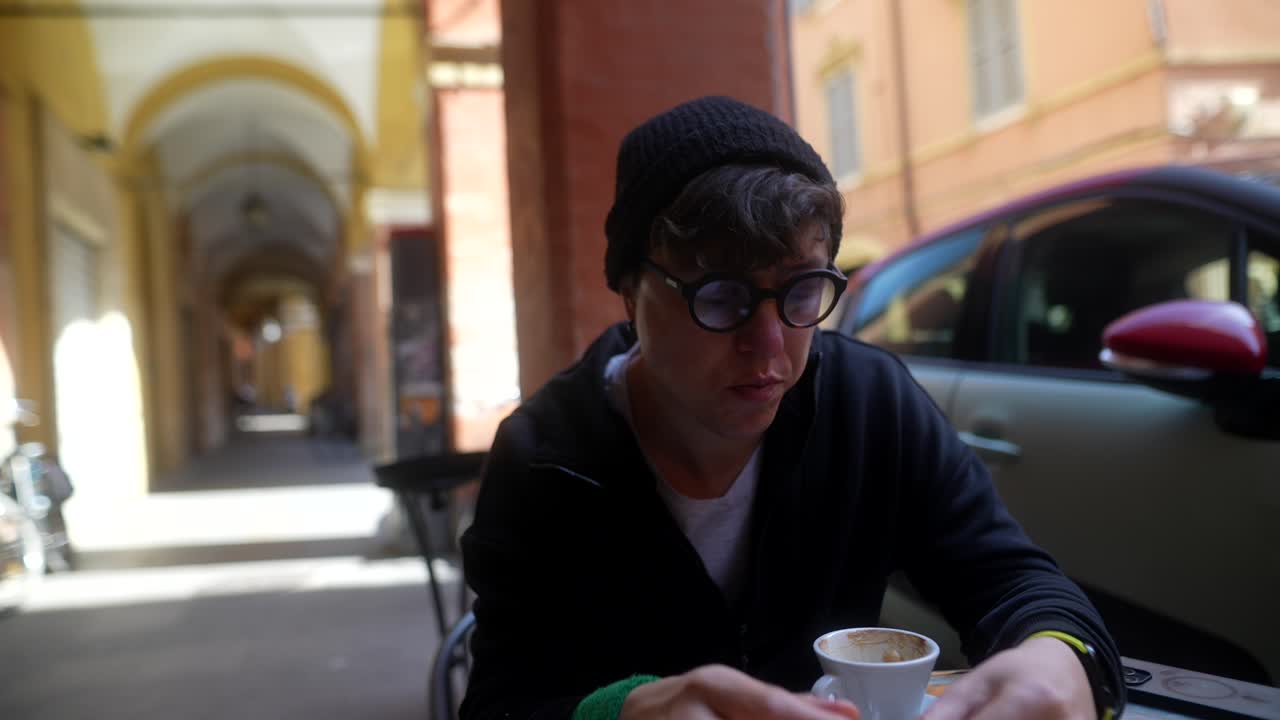 Man enjoying coffee in a European city