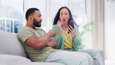 Argue,-smartphone-and-couple-on-sofa