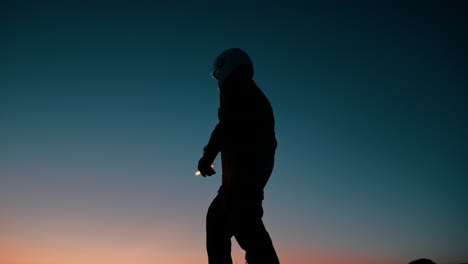 silhouette of an astronaut walks on a mountain before the space mission