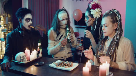 friends talking at a halloween party