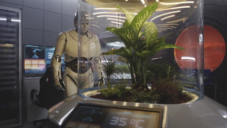 Robot tending a plant in a space lab
