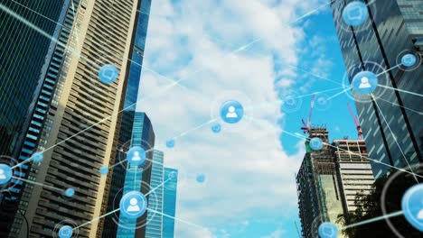 animation of network of digital icons against low angle view of tall buildings and blue sky