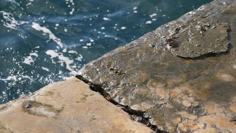 water lapping at a stone pier