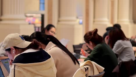 students focused on studying in a library