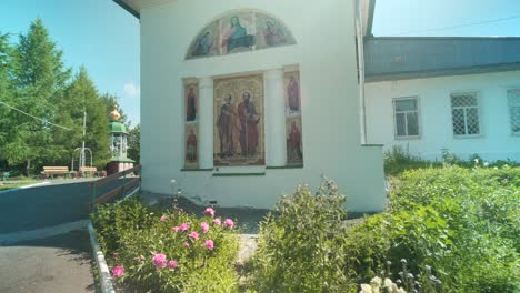 orthodox church exterior with icons and gardens