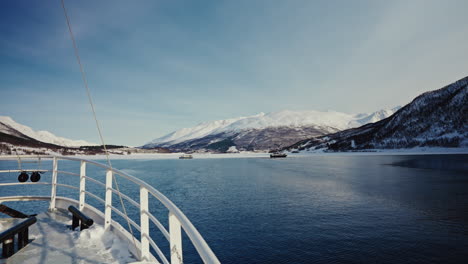 static shot of boat bow cruising along the norwegian fjords