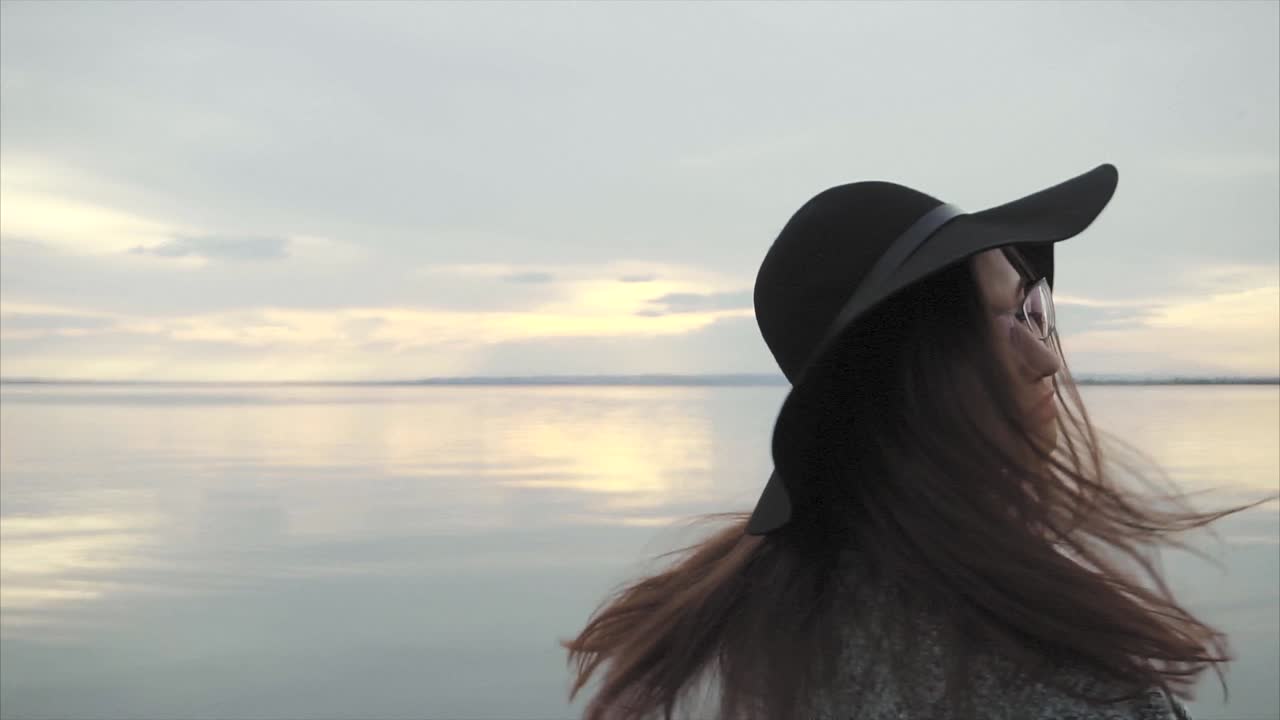 Woman at Sunset by the Lake