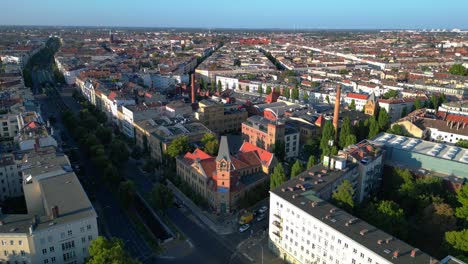 berlin's urban landscape, capturing a mix of residential and commercial buildings, streets, and green spaces. marvelous aerial view flight static tripod hovering drone