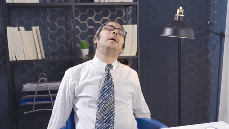 funny lazy office worker napping at workplace. inefficient tired male employee.